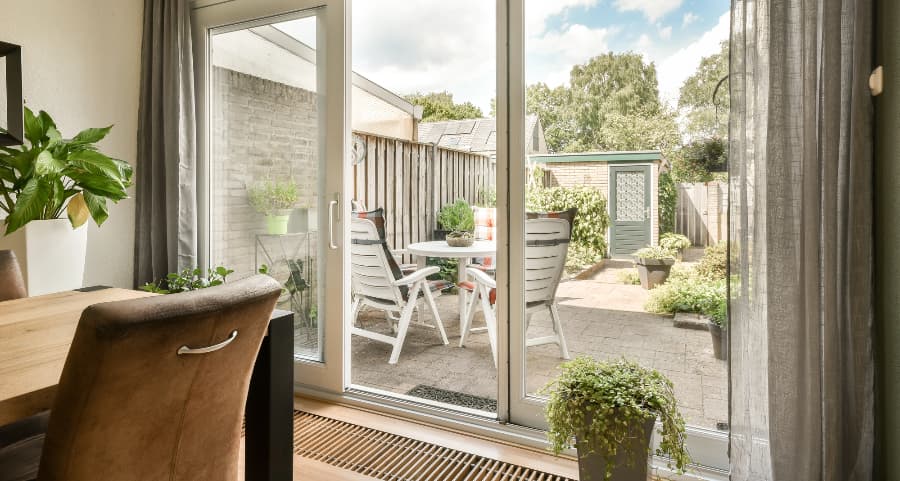 Sliding glass door offering easy access to a back patio